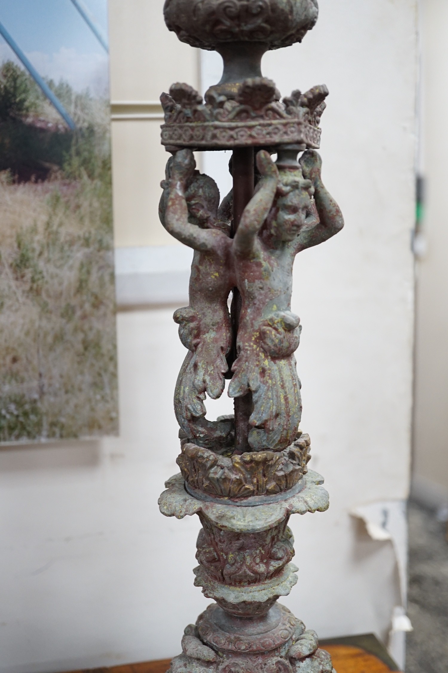 A pair French cast metal candlesticks. 47cm tall